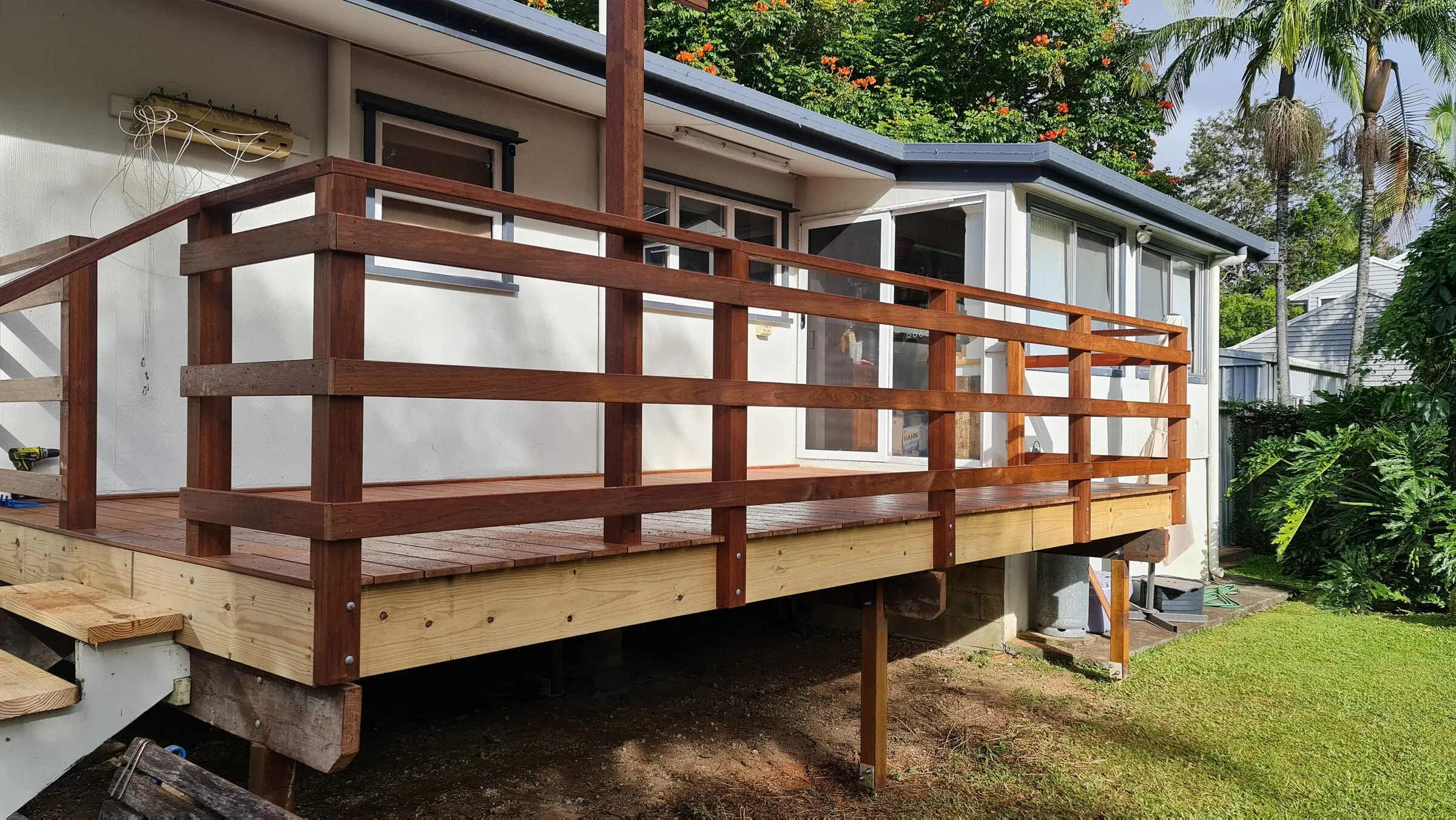 The completed deck along the back of the house, hardwood balustrade throughout.